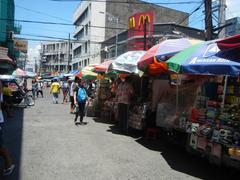 Street corner at A. Bautista and Hidalgo Street in Quiapo, Manila with busy urban surroundings