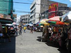 Street corner of A. Bautista and Hidalgo Street in Quiapo, Manila with buildings and trees
