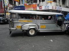 Hidalgo Street corner A. Bautista Street in Quiapo, Manila beside Estero de Quiapo with buildings and vehicles