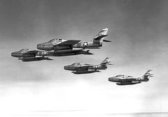 Four F-84F Thunderstreak fighter jets of the 164th Tactical Fighter Squadron flying in formation