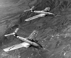 US Air Force Republic YF-84F Thunderstreak and YRF-84F Thunderflash fighter jets in flight near Edwards Air Force Base California 1952