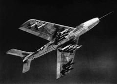 Underside view of a U.S. Air Force Republic F-84F Thunderstreak armed with 24 HVAR rockets