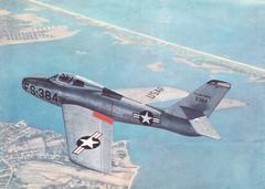 Republic F-84F Thunderstreak jet fighter aircraft in flight with landing gear extended