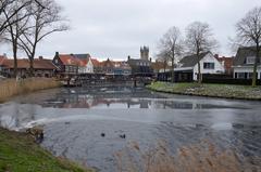 Frozen Damse Vaart canal covered in ice at Kaai in Sluis during winter 2024
