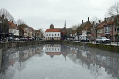 Frozen Damse Vaart canal covered in ice at Stenen Kade in Sluis during winter 2024