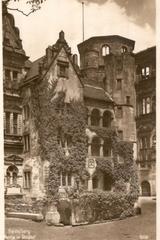 Old postcard view of Heidelberg Schloss courtyard with historical buildings and people