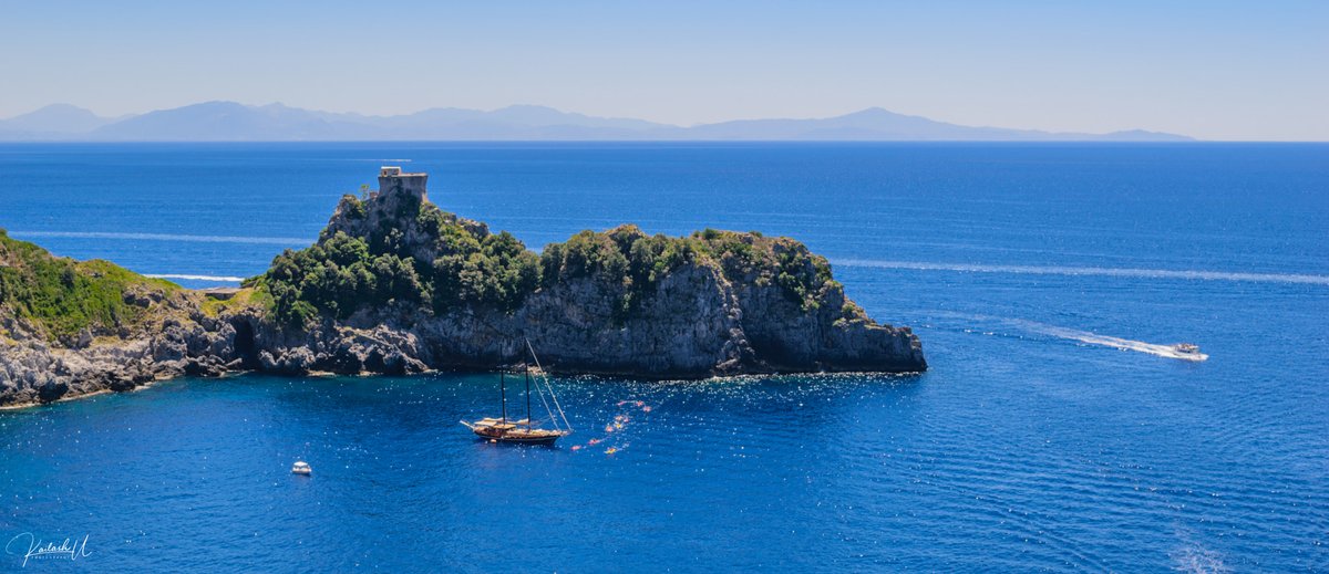 Scenic view of Amalfi Coast with colorful houses on cliffs and blue sea