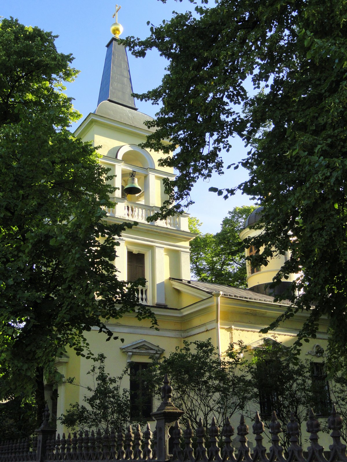 Holy Trinity Church in Helsinki with neoclassical architecture under clear sky