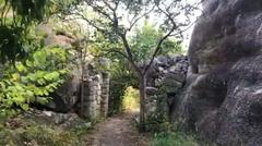 Ancient Panch Pandava caves carved into rock face in India