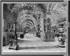 Interior view of the Vatican Library in Rome with bookshelves and classical architecture