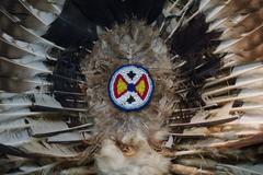 Back bustle made of eagle feather, wood, glass, and leather from the Wolastoqiyik Wahsipekuk, Tobique, New Brunswick, 20th century