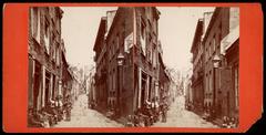 Historic black and white photograph of Champlain Street in Quebec City with vintage buildings and streetcars