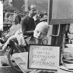 Street vendor at Waterlooplein market in Amsterdam selling goods in 1964