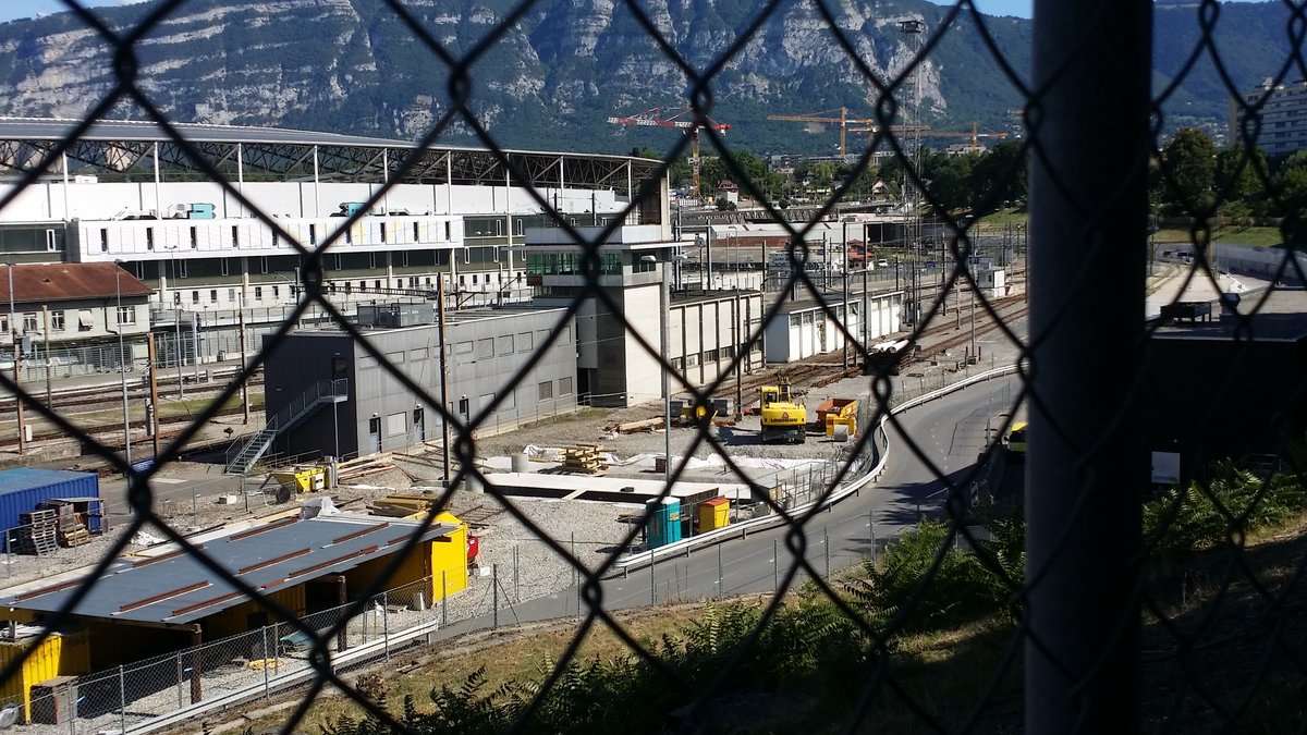 View of La Praille from Lancy with new CEVA railway lines and Lancy-Bachet station access, Geneva stadium in the background