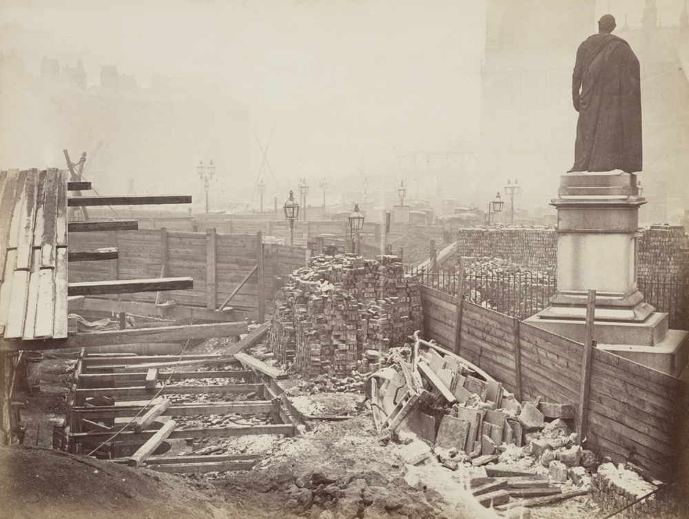 Construction of the Metropolitan District Railway in Westminster near Parliament Square circa 1866 with George Canning memorial and Houses of Parliament in the background