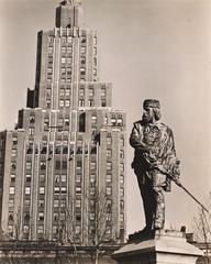 Statue of Garibaldi in Washington Square Park with 1 Fifth Avenue building in the background