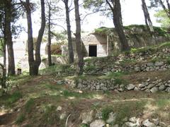 View of Villa Jovis on Capri island surrounded by lush greenery as seen after a two-hour walk