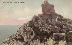 Lighthouse Faro di Tiberio surrounded by water at sunset