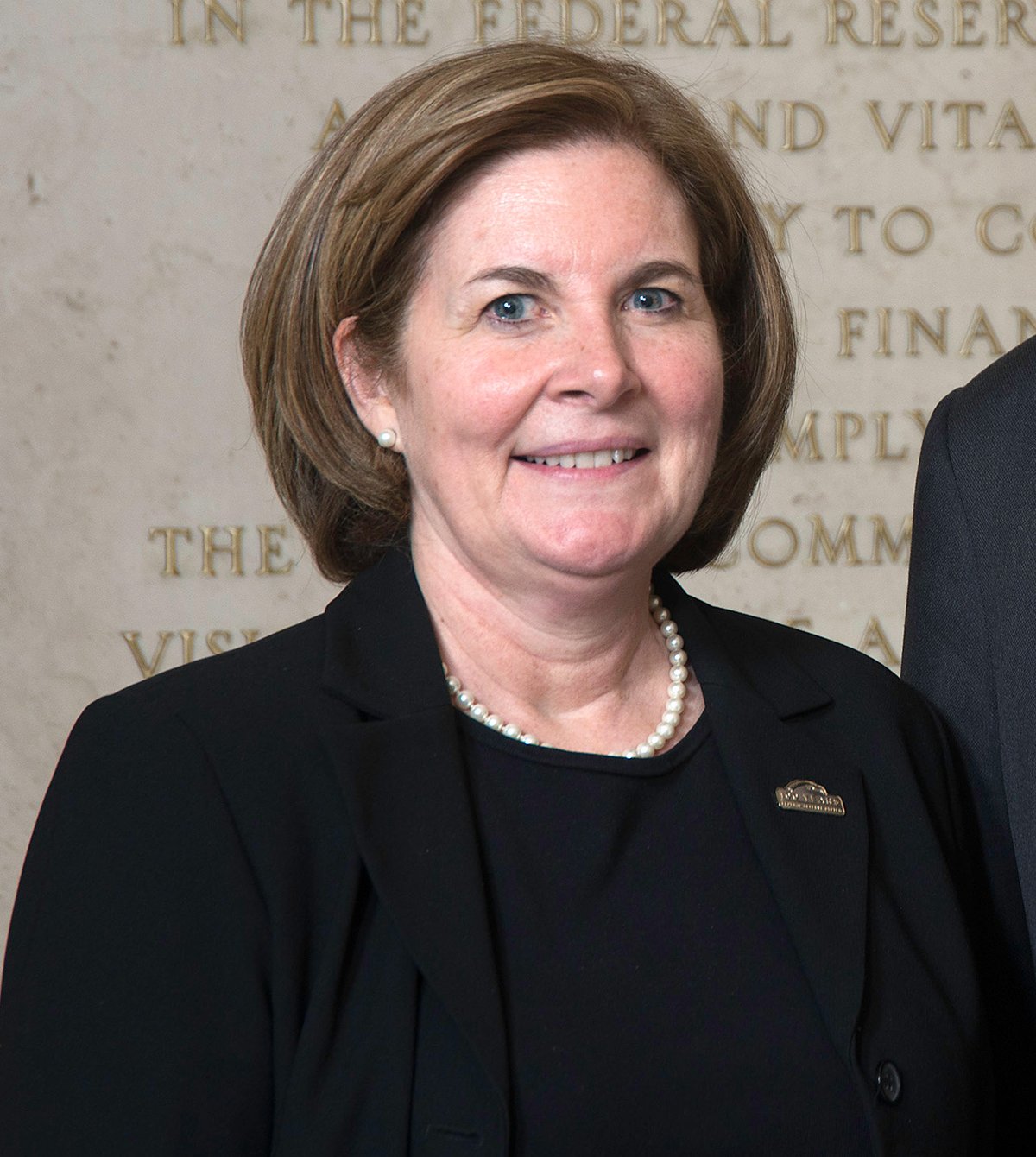 Portraits of Esther L. George and Thomas M. Hoenig, current and former Federal Reserve Bank Kansas City Presidents