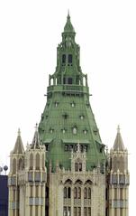 Cass Gilbert's Woolworth Building towering in New York City with clear blue sky