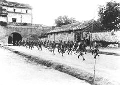 Chinese soldier running out of Wanping City to battle position during wartime