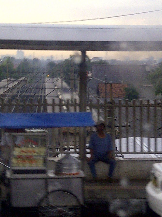 Vendor selling goods on the Stasiun Cawang flyover