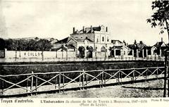 Old postcard of the Troyes embankment in Aube, France showing historic buildings and waterfront