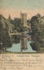 Entrance of Zoologischer Garten Frankfurt am Main with sculptures and visitors