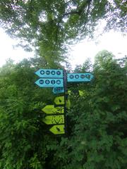 Sign at the entrance of Korkeasaari Zoo in Helsinki with trees in background