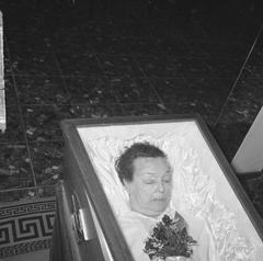 Black and white photograph of Fien de la Mar lying in repose at De la Mar theater in Amsterdam, dated April 28, 1965