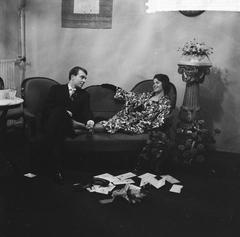 Black and white photo of wedding ceremony of Hans van de Busken and Phil Ackerlin at Nieuwe de la Mar-theater foyer, Amsterdam, April 26, 1961