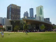 Exterior view of the new World of Coca-Cola building with large Coca-Cola logo and modern architecture