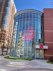 The World of Coca-Cola entrance in Atlanta, GA with large Coca-Cola logo and cultural exhibits