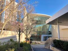 Exterior view of The World of Coca-Cola museum in Atlanta, Georgia with Coca-Cola branding and visitors outside