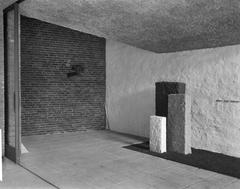 Memorial site for Jewish residents of Amsterdam in the Aula building with eternal flame, black and white photo dated 1962