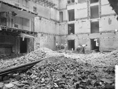 Black and white photograph of the entrance portal of the Hollandse Schouwburg being set up as a memorial site in Amsterdam on September 19, 1960.