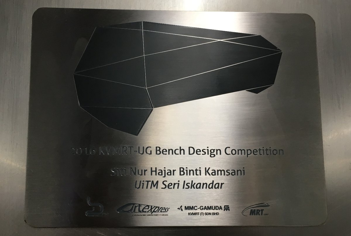 Steel plaque at Cochrane Station platform with student's name Siti Nur Hajar Binti Kamsani for bench design