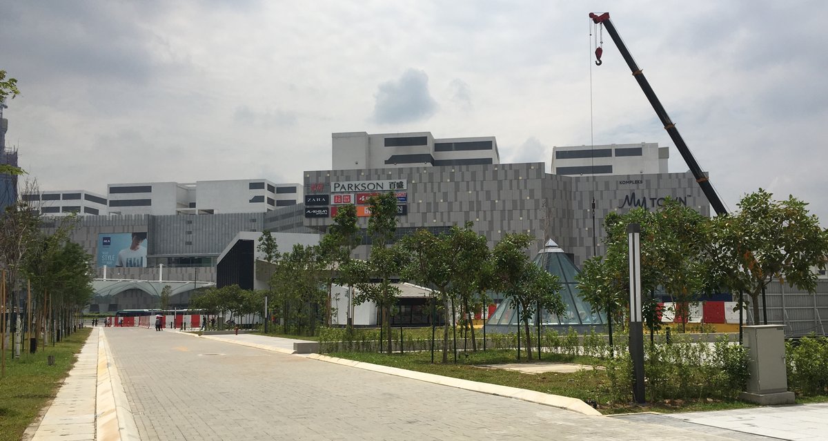 Ground level plaza view of Cochrane station with MyTown Shopping Complex in Kuala Lumpur