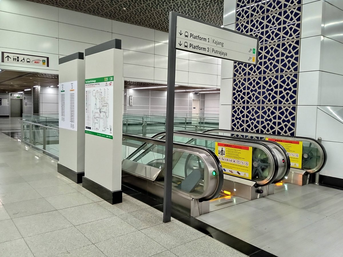 Tun Razak Exchange MRT Station concourse area in Kuala Lumpur with modern architecture and commuters