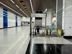 Interior of Tun Razak Exchange MRT Station concourse in Kuala Lumpur showing modern design and lighting