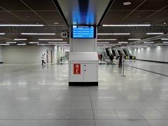 Main concourse level of Tun Razak Exchange MRT Station in Kuala Lumpur with modern design and escalators