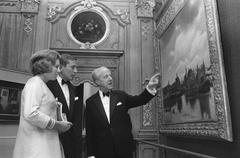 Princess Beatrix and Prince Claus at the opening of the Vermeer exhibition at Mauritshuis in The Hague, with Dr. A.B. de Vries explaining