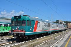 Diagnostic train Galileo with ALn 668.1408 and 3173 railcars at Genova Brignole station pulled by E.656.557 locomotive