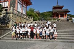 Dr. Abhishek Shukla with school children in Kyoto Japan during geriatric care observership
