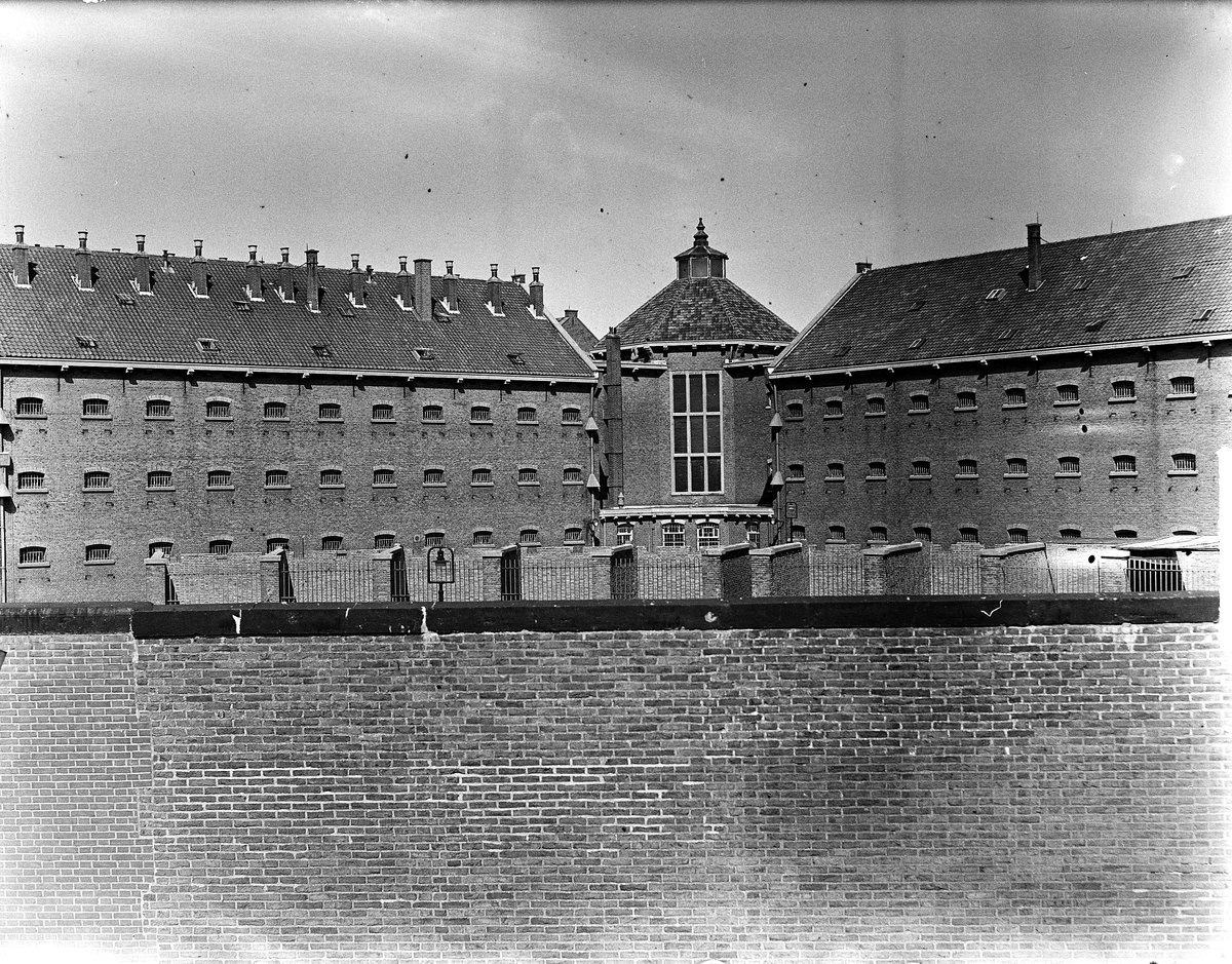 Exterior view of Cellenbarakken of Strafgevangenis Scheveningen prison with surrounding prison wall