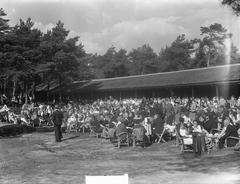Queen Juliana unveiling a war memorial at the Oranjehotel prison in Scheveningen on September 16, 1950