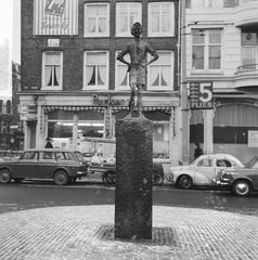 Het Lieverdje statue on the Spui square in Amsterdam photographed in black and white, January 14, 1966