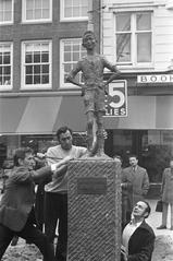 Black and white photograph of Lieverdje statue back on its pedestal at Spui, Amsterdam on October 10, 1972