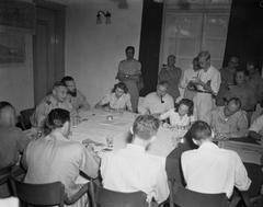 Lt. General S.H. Spoor holding a press conference at Hotel des Indes in Batavia in July 1947 with American journalist Martha Gellhorn and Dutch journalist Jan Bouwer present