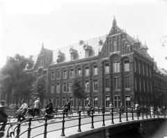 1955 street view of Kloveniersburgwal and the east wing of the Oost-Indisch Huis in Amsterdam